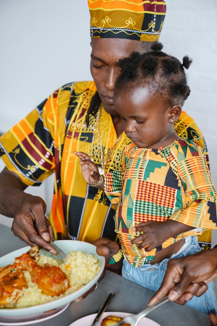 Dad And Child Eating Together