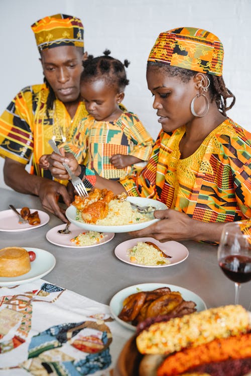 Free A Happy Family Eating Together Stock Photo