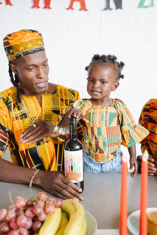 Family in Traditional Clothes Celebrating Kwanzaa