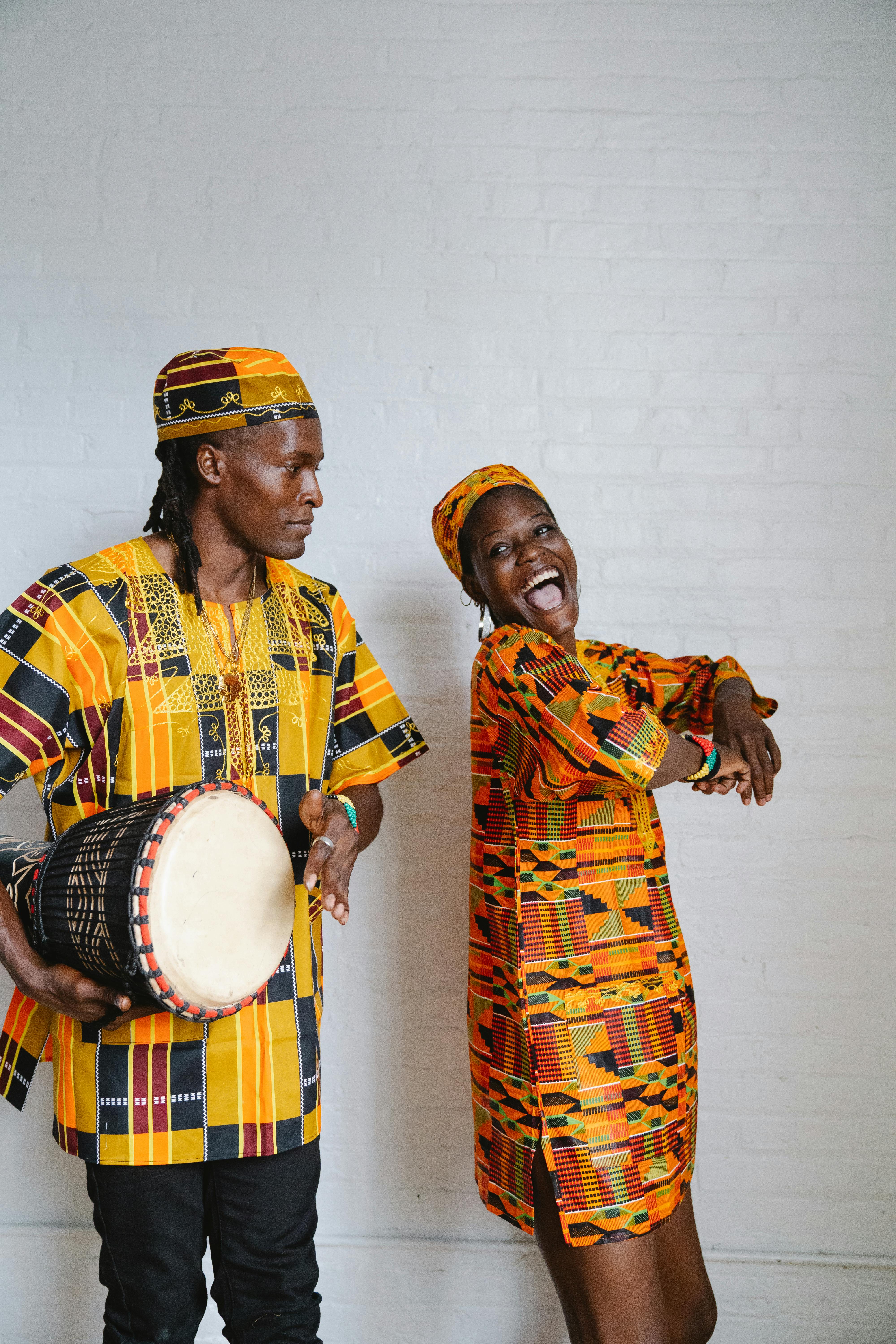 A Couple in Traditional Clothes Celebrating Kwanzaa · Free Stock Photo