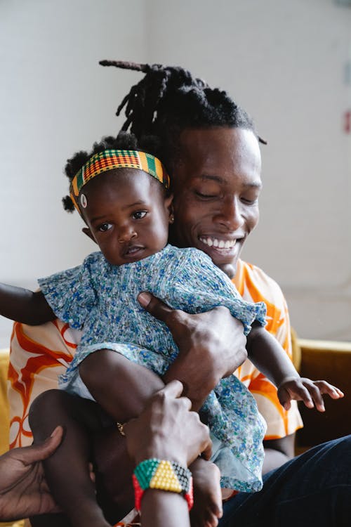 Dad Carrying His Cute Daughter