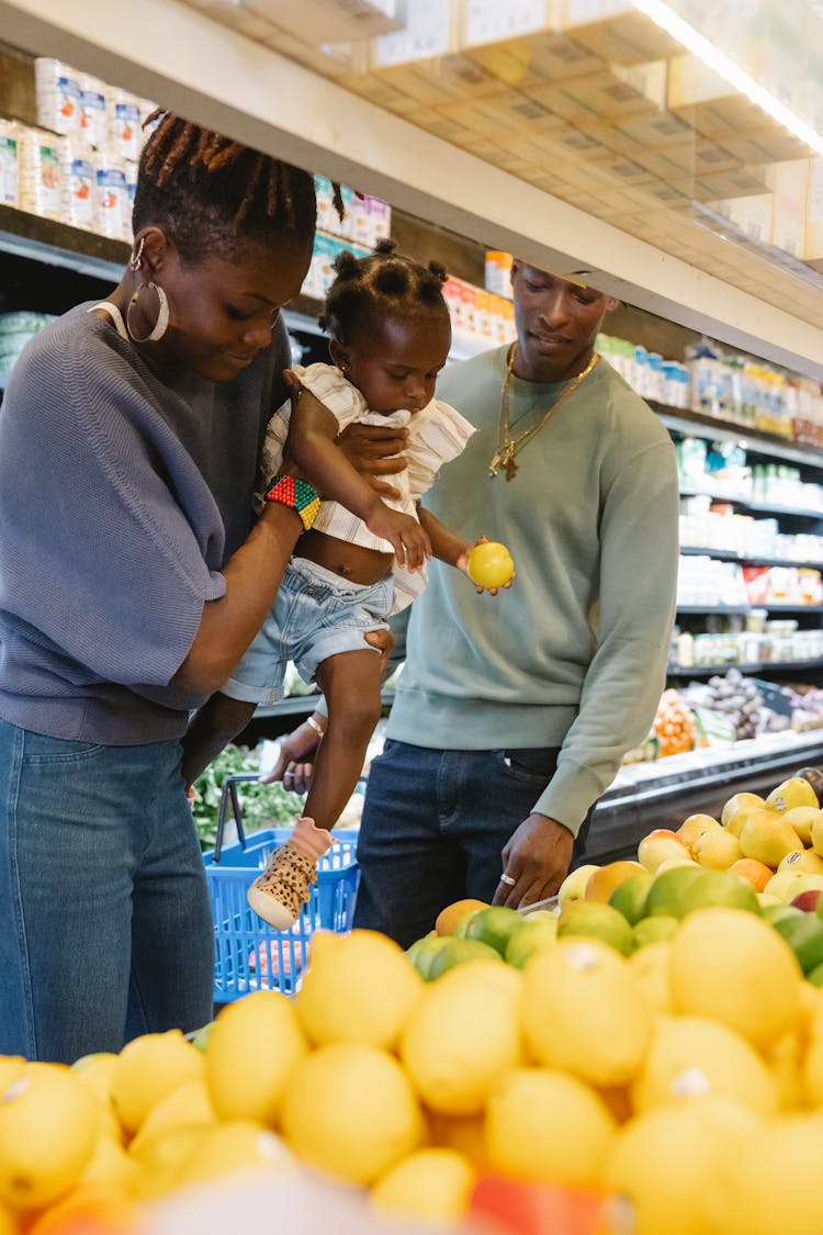 A Family Buying Groceries In A Supermarket