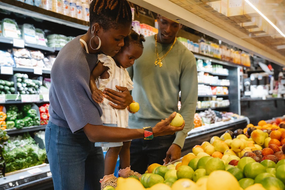 Free A Family Buying Groceries in a Supermarket Stock Photo