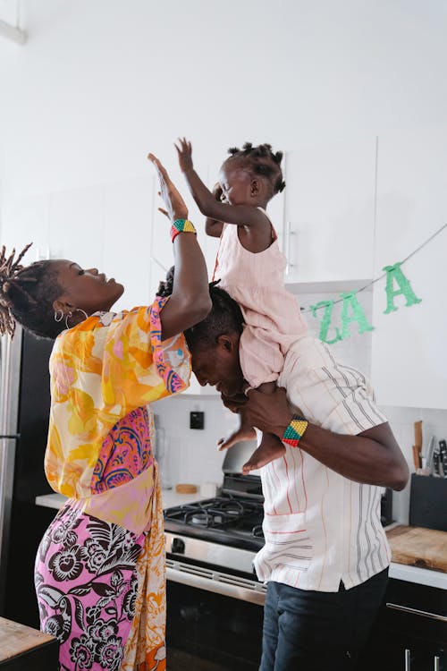 A Happy Family Doing High Five