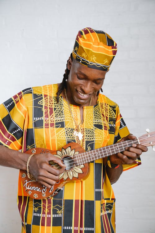 A Man Playing Ukulele 