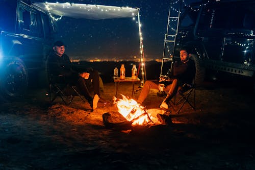 Men Sitting Near the Campfire