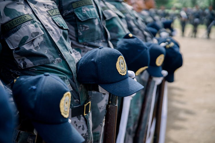 Close Up Of Police Officers Caps