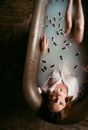 Woman in White Dress Lying on Bed