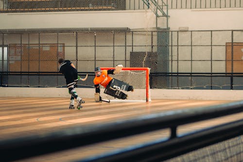 People Playing Roller Hockey