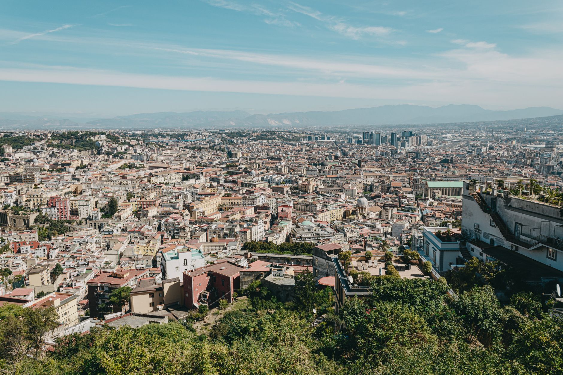 Stunning aerial view of Naples, Italy capturing its vibrant urban sprawl and scenic landscape.