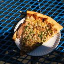 Close-Up Shot of a Slice of Pizza on a Plate