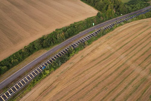 Aerial View of Roads between a Grassy Field