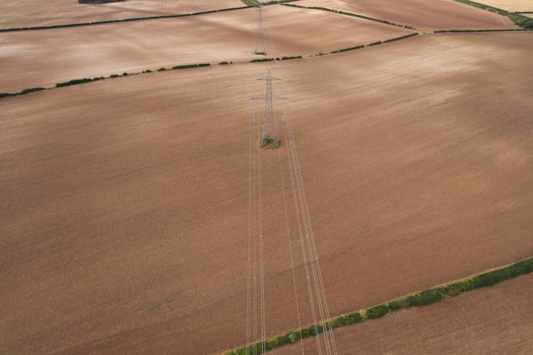 Electricity Pylons In Agricultural Fields