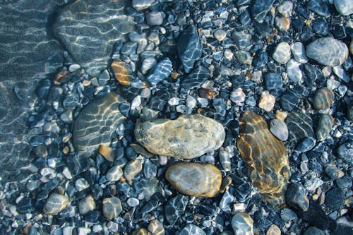 Free Close-Up Shot of Stones on the Beach Stock Photo