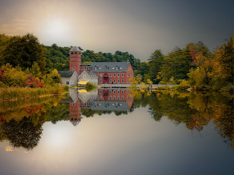 Reflection Of Countryside Mansion In Lake