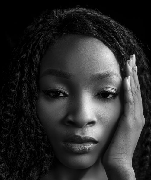 Free Black and white portrait capturing a woman's serene and introspective expression. Stock Photo