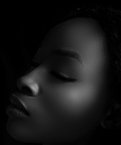 Free Artistic black and white portrait of a woman with closed eyes, highlighting serene expression. Stock Photo