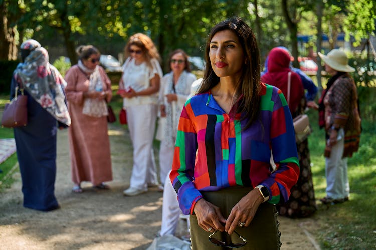 Positive Adult Woman Standing In Park