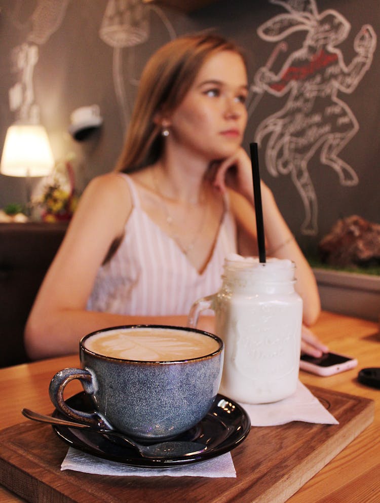 Latte Served In Cup Before Woman