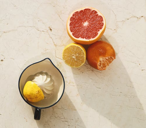 A Citrus Fruits Near the Juicer