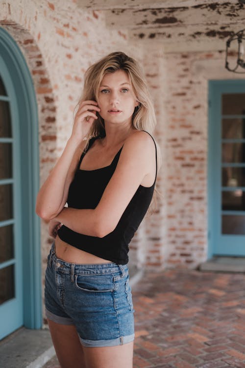 Woman Wearing Black Sleeveless Top Posing