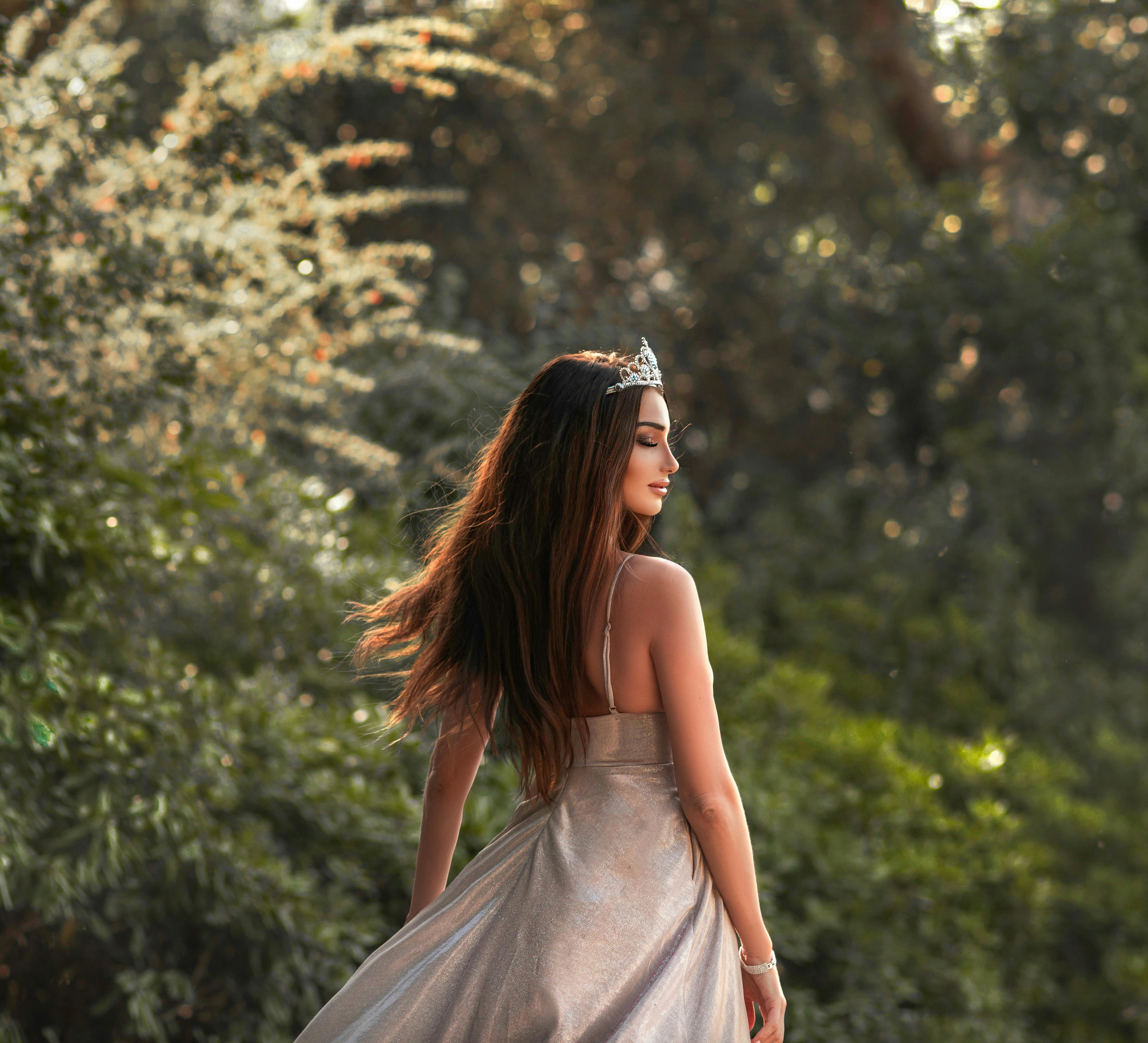 A Young Cute Girl in a White Dress with a Crown of Dry Grass on Her Head  Poses Beautifully. Positive Attitude Stock Photo - Image of holiday,  beauty: 244208682