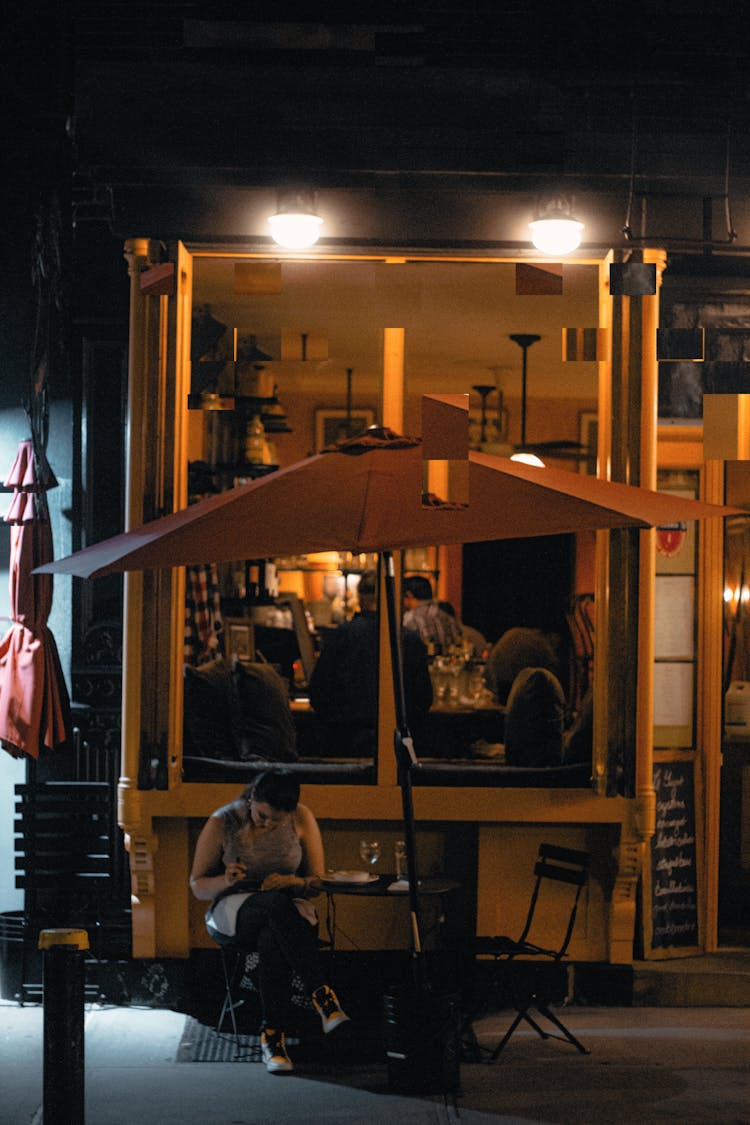 Photo Of A Bar In A Metal Container By Night