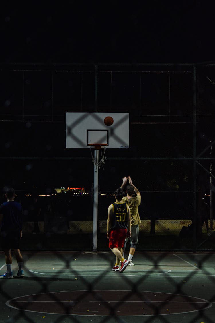 Two Men Playing Basketball 