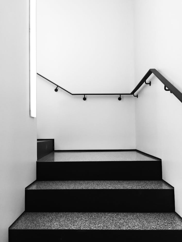 Gray And Black Steps With Black Railing