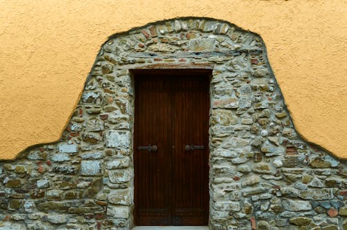 Brown Wooden Door on Stone Wall