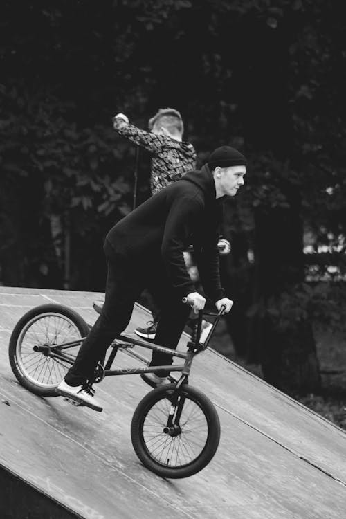 A Man Riding a Bike on the Ramp