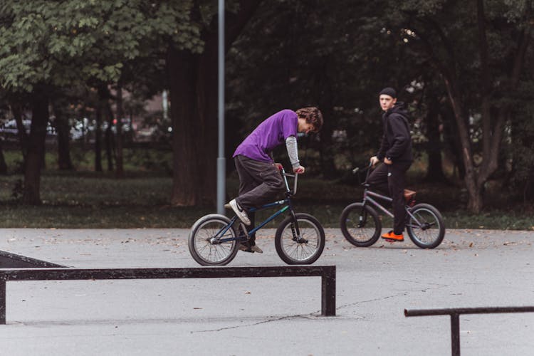 Young Boys Riding On Bicycles