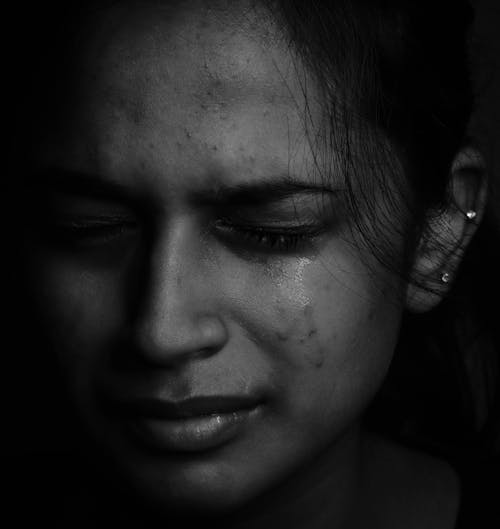 Grayscale Photography of a Woman Crying 