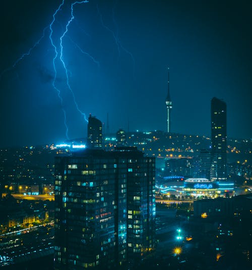 Free Lightning Strike on the High Rise Building During Night Time Stock Photo