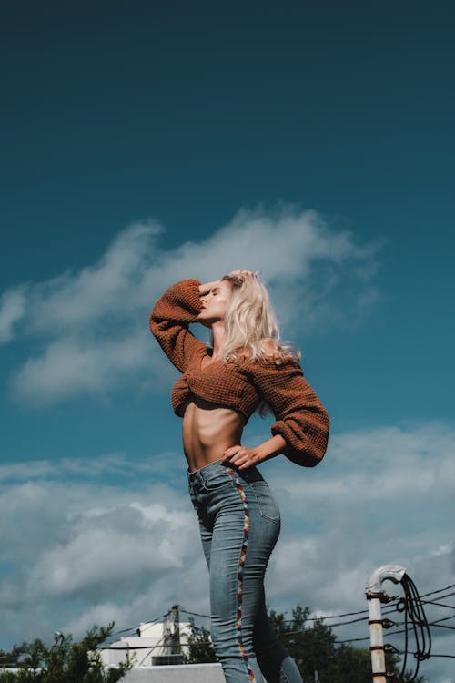 Sexy Woman in Brown Top and Denim Pants