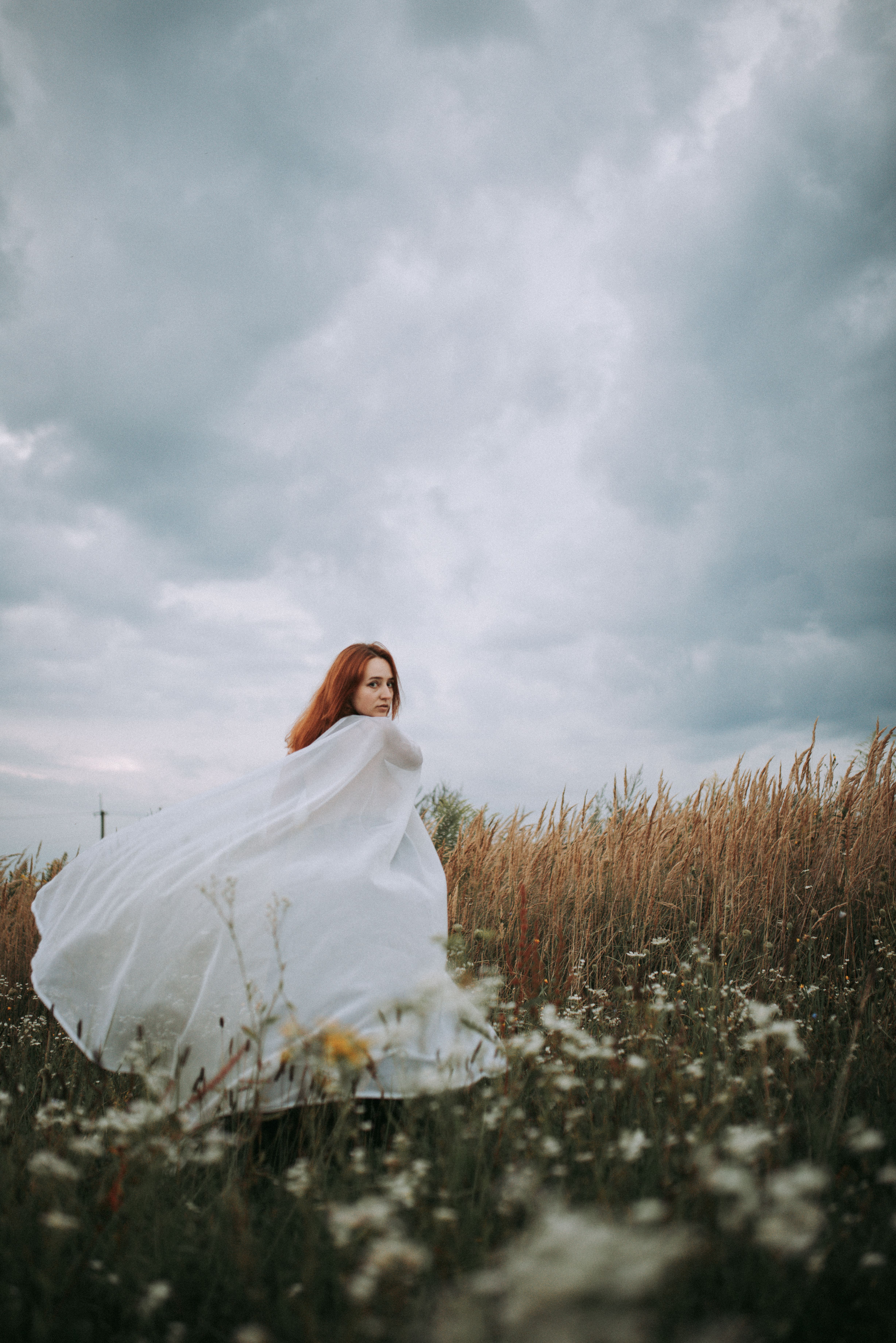 A Woman in White Dress Standing on the Grass Field · Free Stock Photo