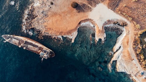 Free Aerial Footage of Ship Wreck on Seashore Stock Photo
