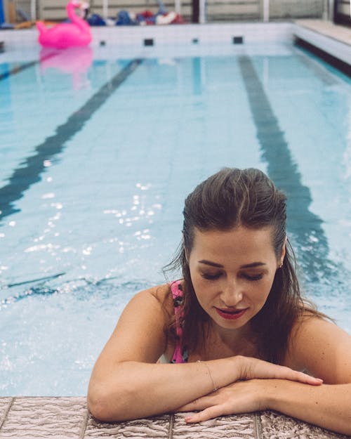 Woman Standing in the Swimming Pool Edge