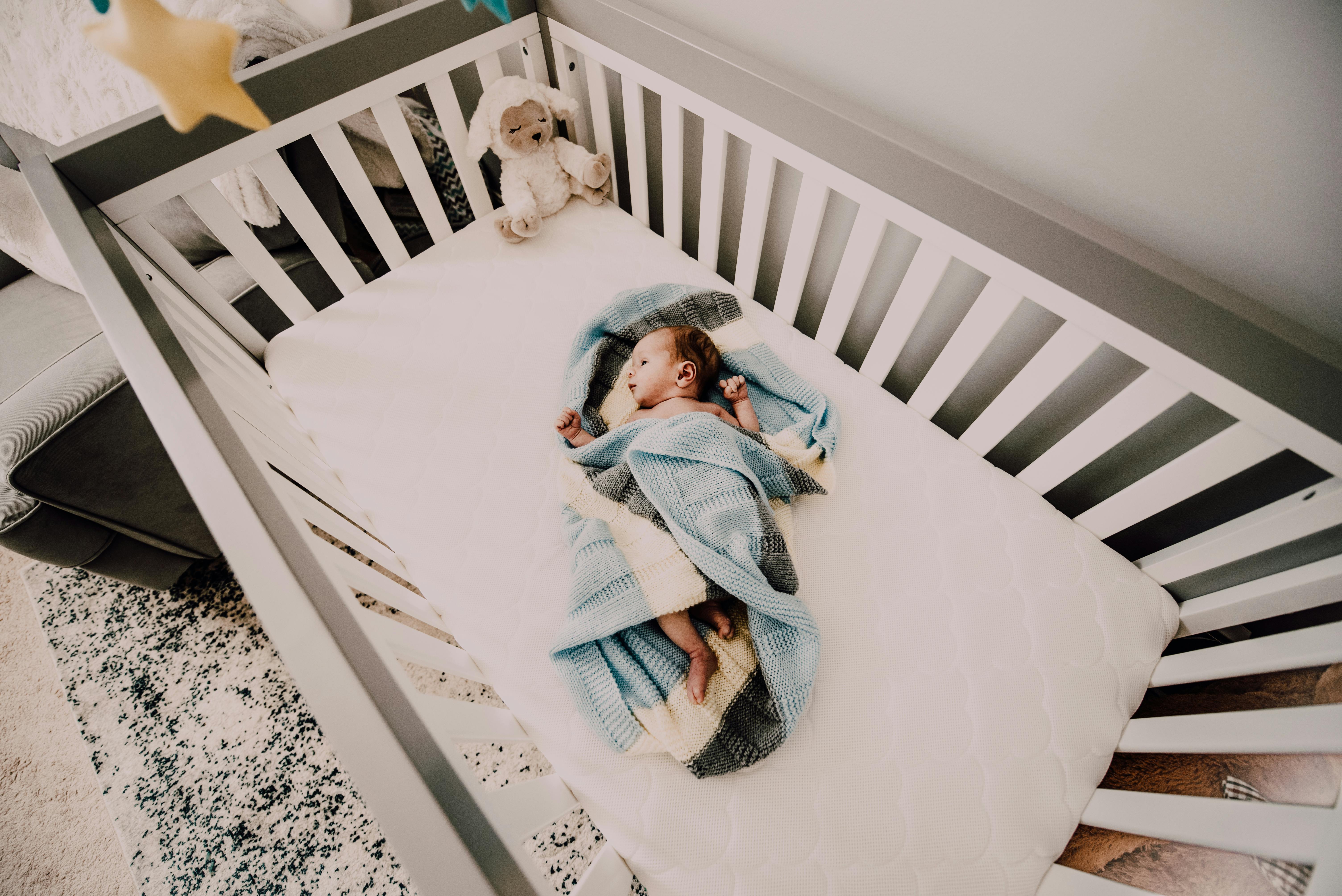 baby in blue blanket