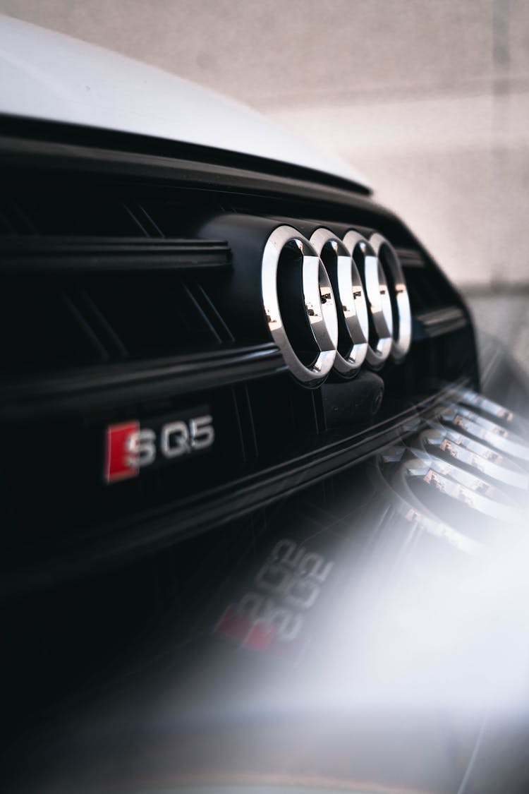 Close Up Shot Of An Audi Emblem