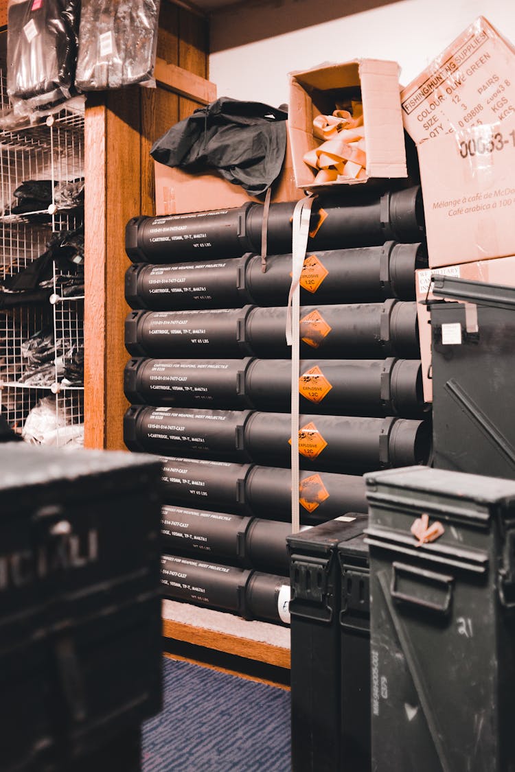 Plastic Pipes, Metal Cases And Paper Boxes In A Depot