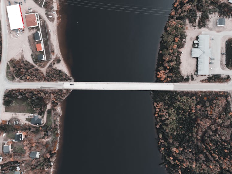 Aerial View Of Bridge Over Waters Connecting Two Villages