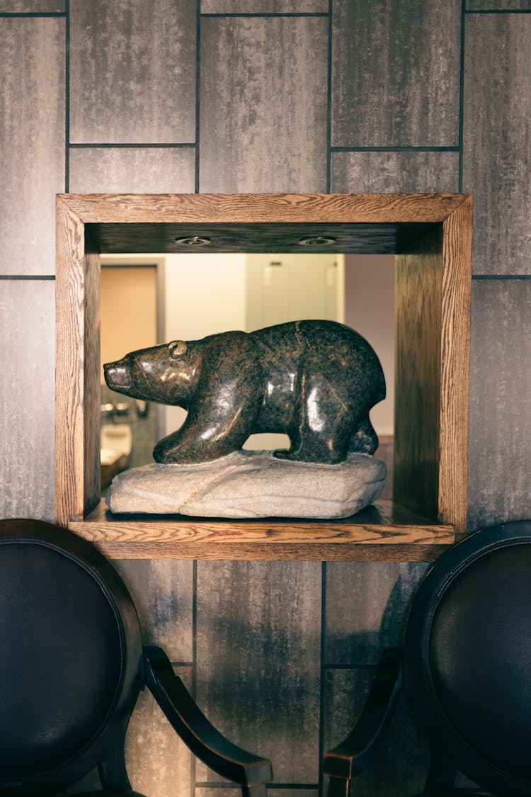 Stone Bear Sculpture In A Internal Wall Window