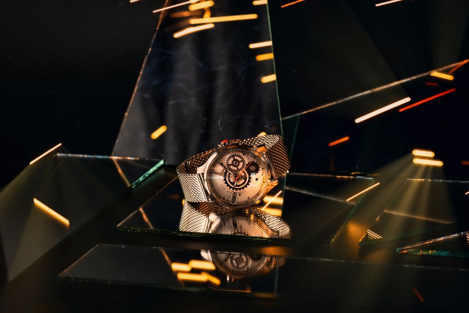 Elegant silver wristwatch on a reflective surface with dynamic lighting effects. Elegant silver wristwatch on a reflective surface with dynamic lighting effects.