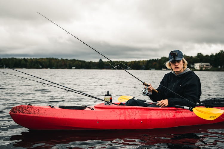 A Man Holding A Fishing Pole 