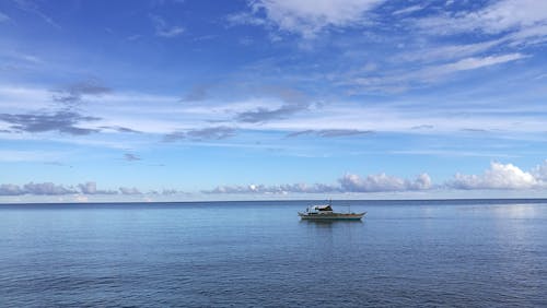 Free Fishing Boat on the Sea Stock Photo