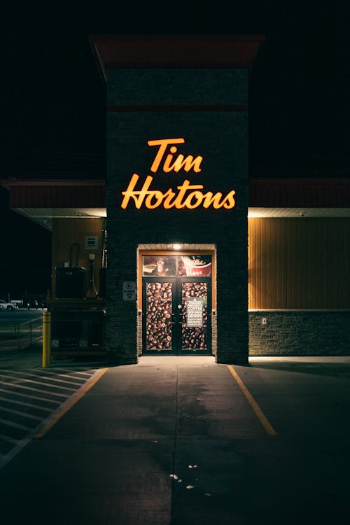 Tim Hortons Neon Signage Over Doors of a Building