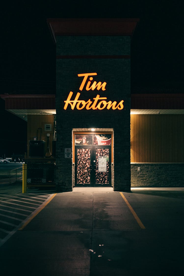 Tim Hortons Neon Signage Over Doors Of A Building