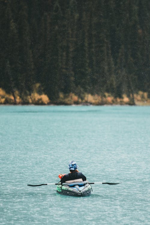 A Person Kayaking in the Lake