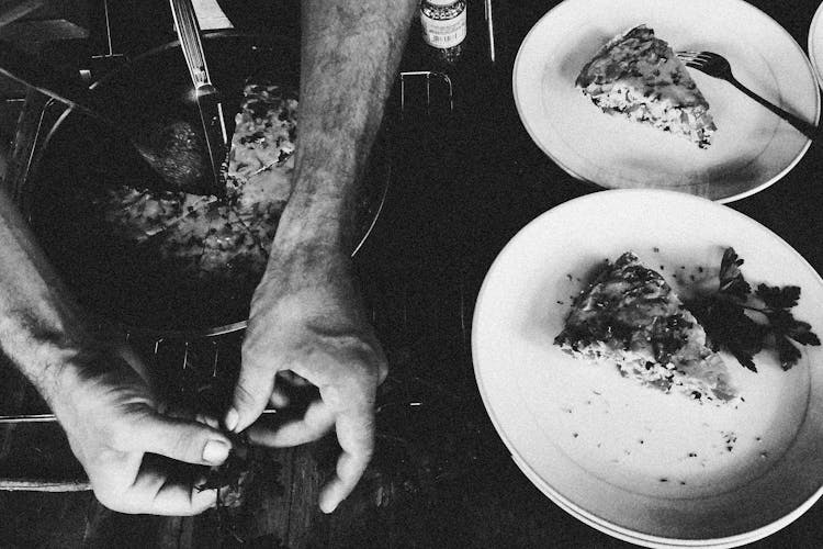 Black And White Photo Of Hands Cooking Food